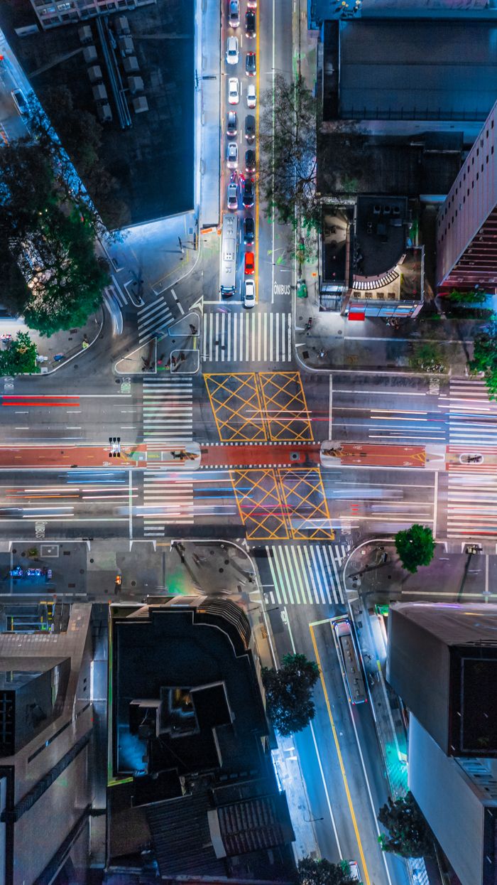 Captivating aerial shot of São Paulo's illuminated urban streets and bustling traffic at night.